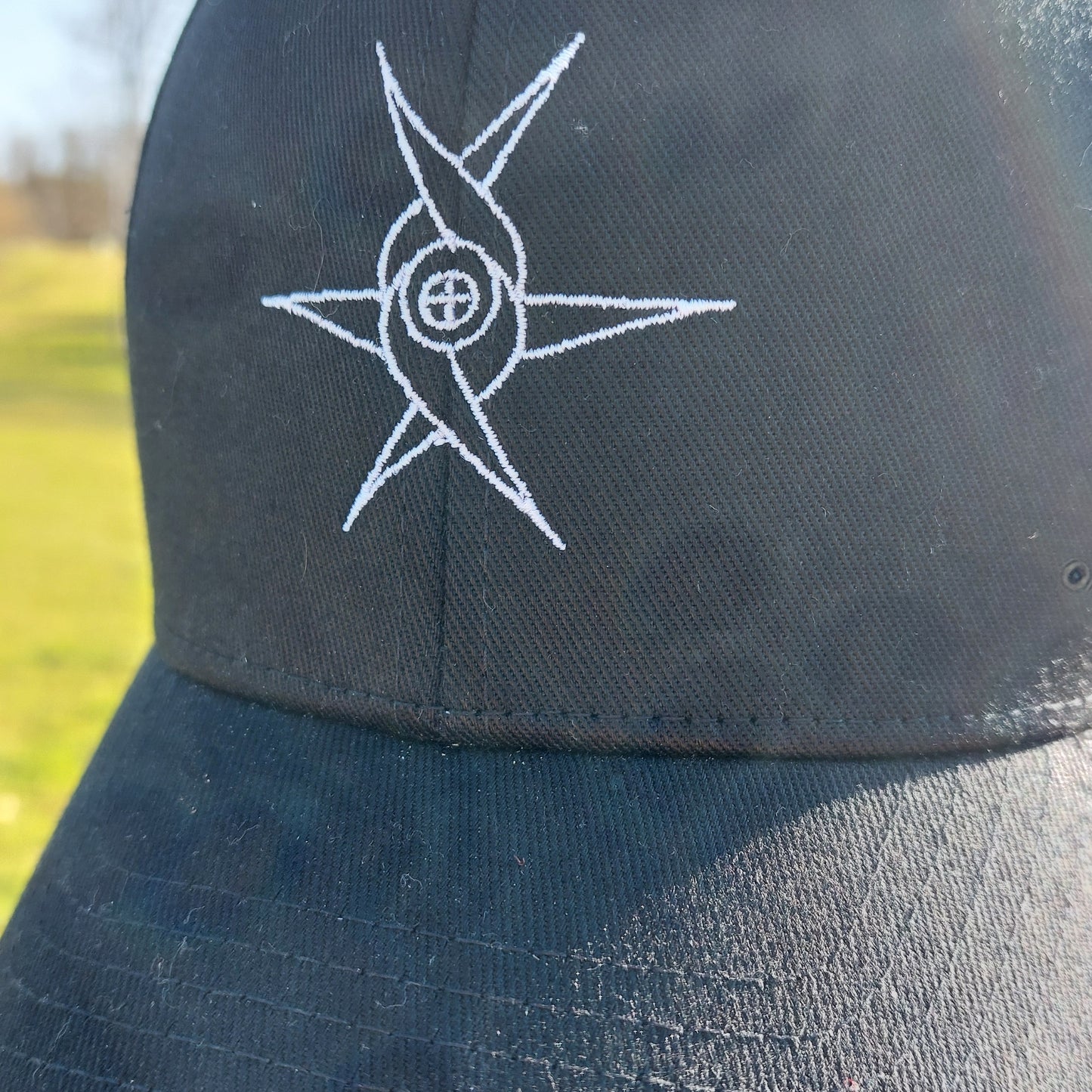 Angel glyph embroidered on classic cap