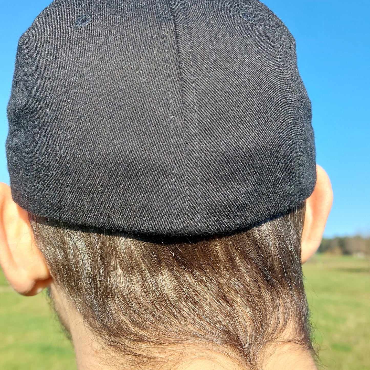 Angel glyph embroidered on classic cap
